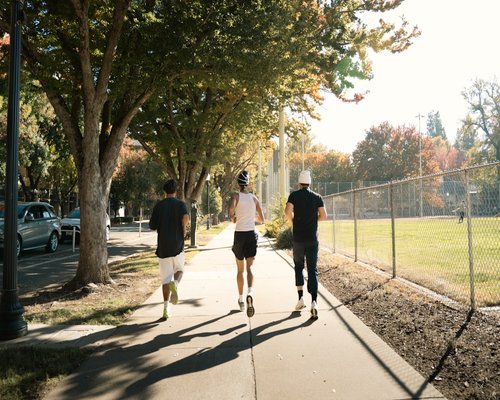 Person jogging in park morning